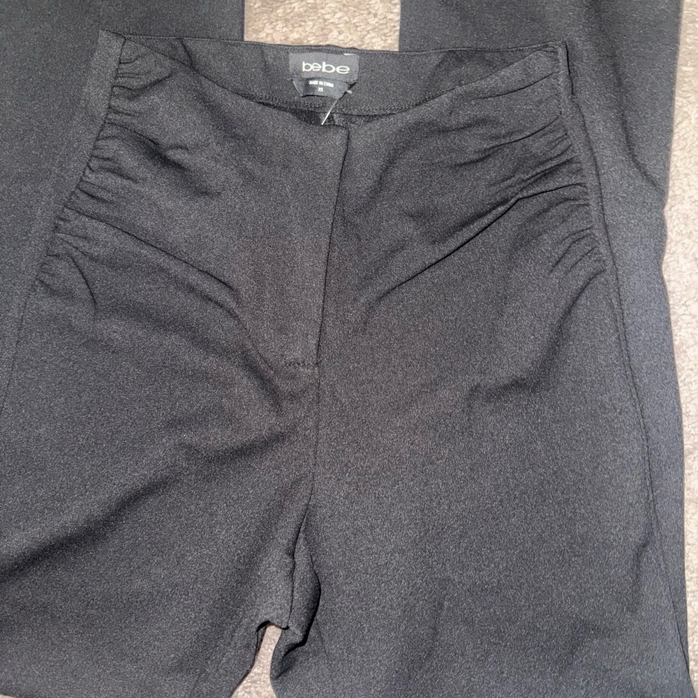 Bebe Elegant Black High-Waist pants with beautiful scrunched up hip design .